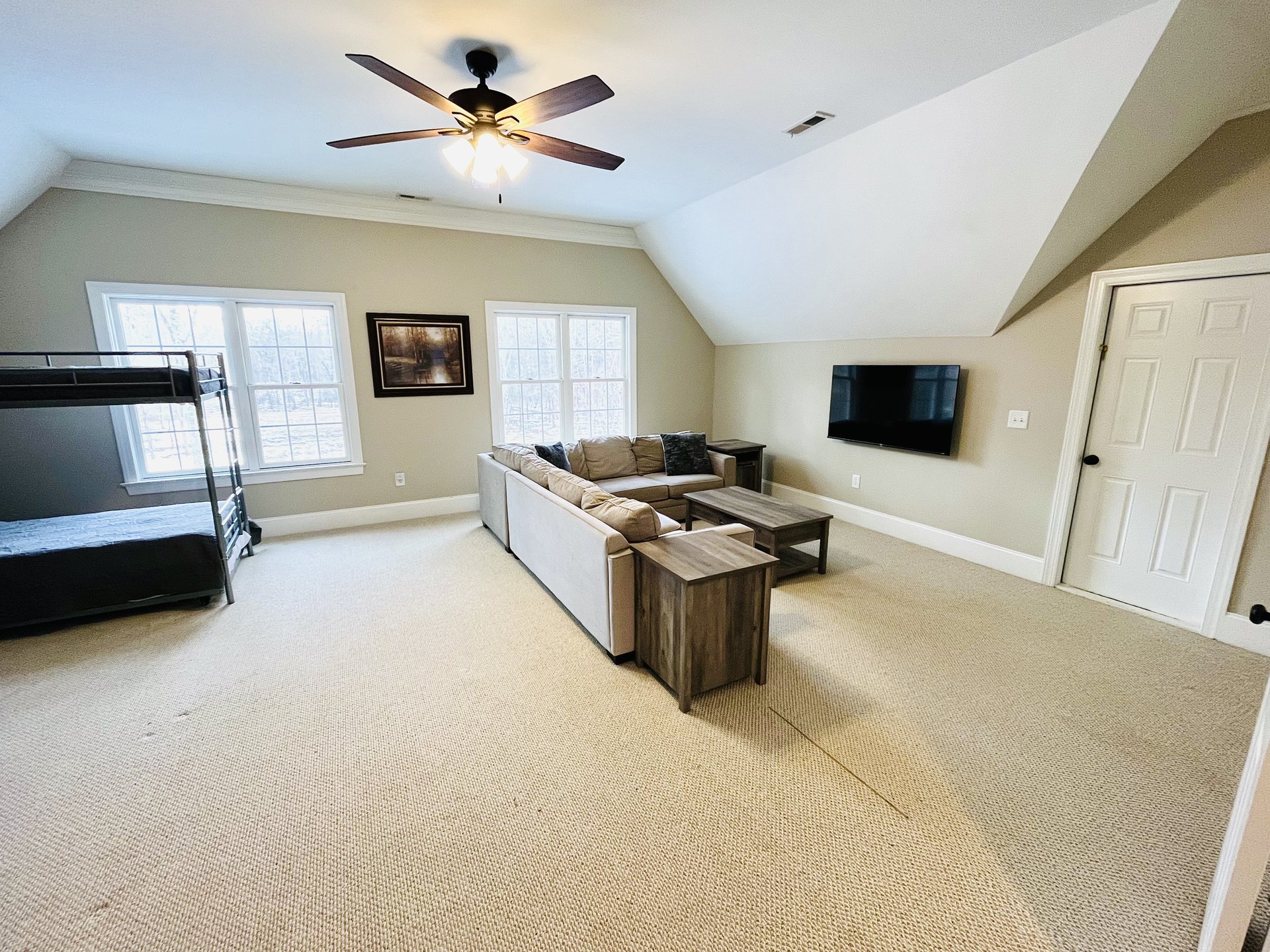 Bunk room TV lounge with sectional