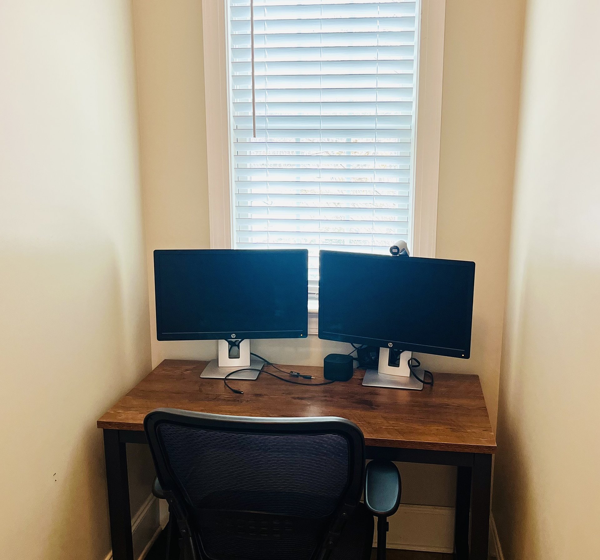 Private office with dual monitors and docking station